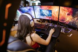 woman-gaming-on-three-monitors